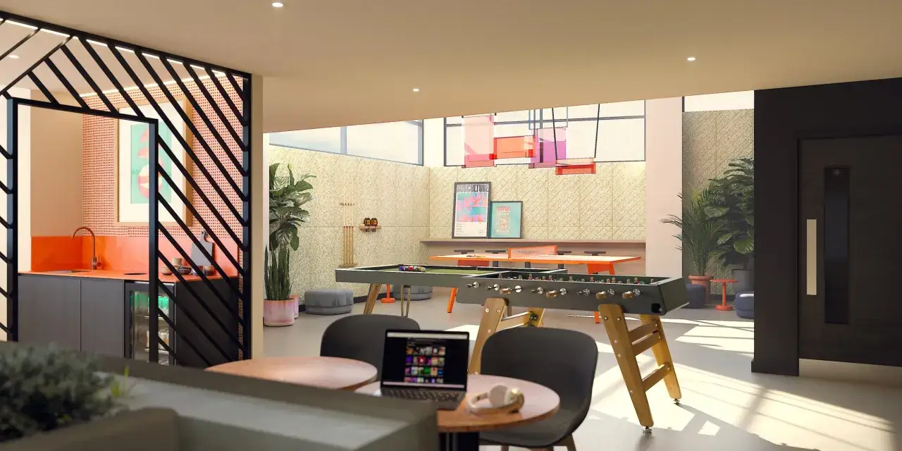 Sala de juegos en lumiere apartamentos con futbolín, mesa de ping-pong, billar y zona de cocina.
